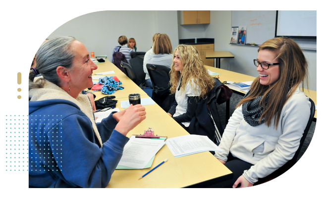 Senior female talks with female student nurse