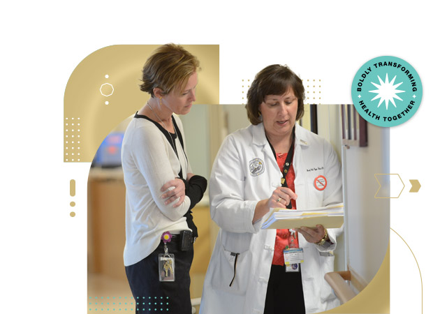 Female student nurse consults with female nurse instructor