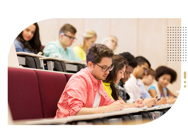Group of students with notebooks in lecture hall