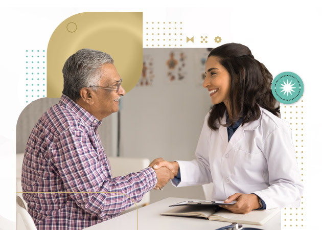 Geriatric practitioner woman and senior Indian patient man shaking hands in clinic office