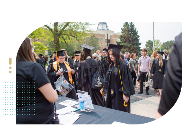 College graduates check in for graduation
