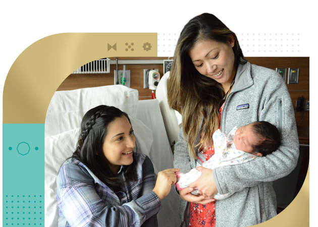 Female patient and nurse looking at infant baby