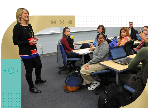 Group of college students in classroom with instructor