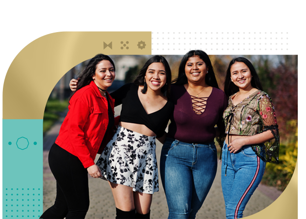 Group of four happy latino girls posed at street
