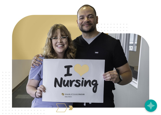 Female and male student nurses holding 