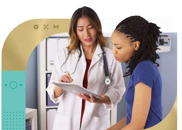 Female nurse reviewing health chart with femail patient