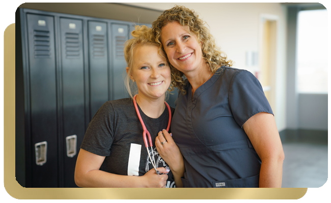 Female student nurse with female nurse instructor