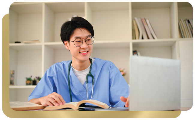 Asisan male nurse reviewing computer work