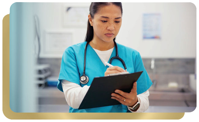 Female nurse checking of items on chart