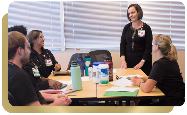 College nursing students listen to professor speak