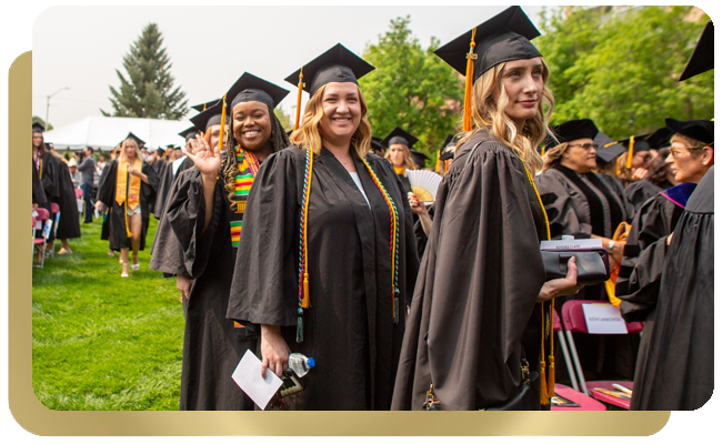 College graduates walking to graduation event
