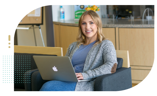 Female student nurse studying with computer