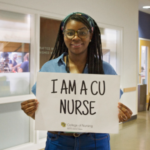 Jessica Dean with I am a CU Nurse sign