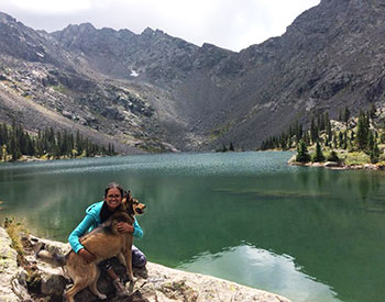 Betzabe Karagozian Betzabe Karagozian poses for a photo with her dog in front of a mountain lake