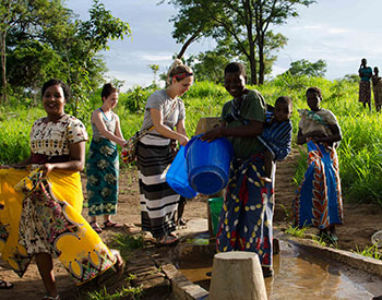 CU Nursing students and several Malawi residents interacting