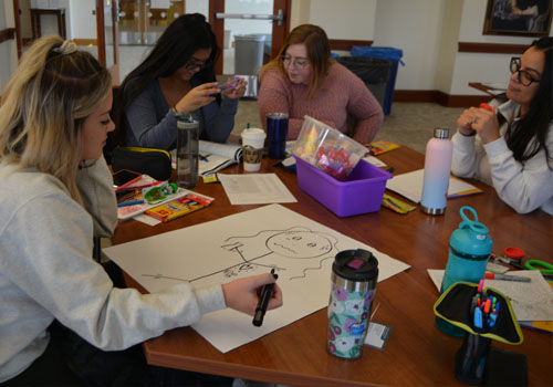 Activities are a large part of the MHFA training. Here, students illustrate signs and symptoms of anxiety.