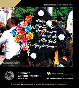 Back of a graduation cap with wording and flowers