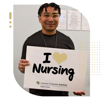 Student nurse holding 'I Am A CU Nurse' sign