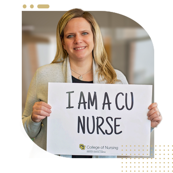 Student nurse holding 'I Am A CU Nurse' sign