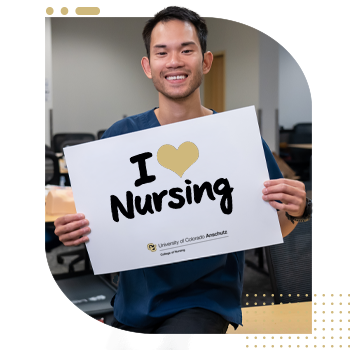 Male student nurse holding 