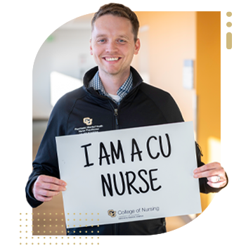 Student nurse holding 'I Am A CU Nurse' sign